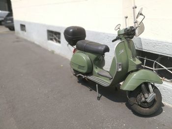 Side view of motor scooter on road