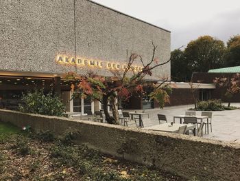 View of text on plant against building