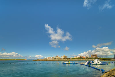 Inflatable slide for water sports, jet ski and motor boating in hamakawa fishing port in okinawa.