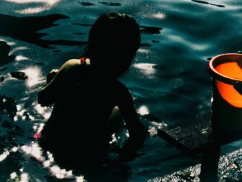 Reflection of woman in water