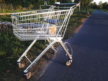 Close-up of empty shopping cart on roadside