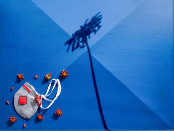 High angle view of toy on blue wall