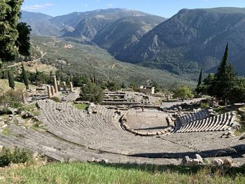 Ancient theater of apollo at the oracle of delphi with the mountains of parnassos in the back