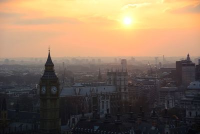 Cityscape against sky during sunset