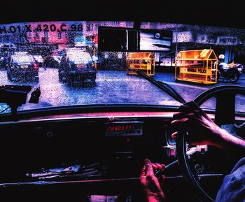 View of vehicles on road at night