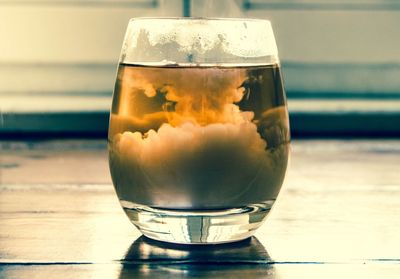 Close-up of beer glass on table