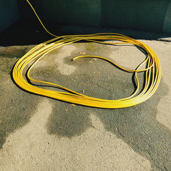 High angle view of yellow lines on road