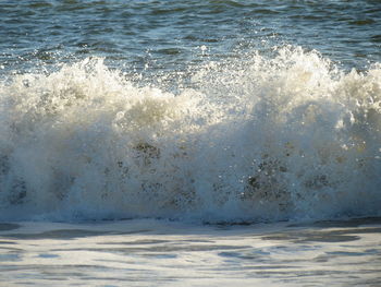 Sea waves splashing on shore