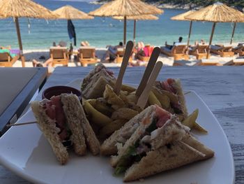 Close-up of food served on table at beach