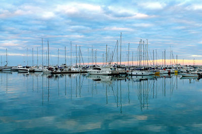 Reflection of the cloudy sky in the harbor of san benedetto del tronto, ascoli piceno, marche, italy