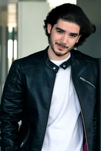 Portrait of young man standing outdoors