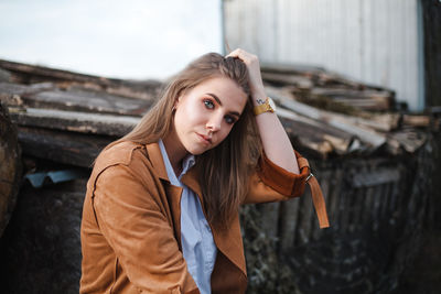 Portrait of young woman standing outdoors