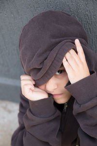 Portrait of cute girl wearing hoodie