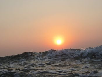 Scenic view of beach against sky during sunset