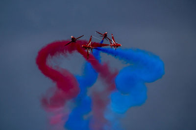 Airplane flying against blue sky