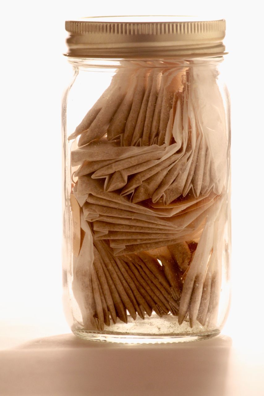 CLOSE-UP OF JAR ON TABLE