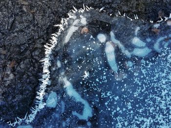 High angle view of snow on sea