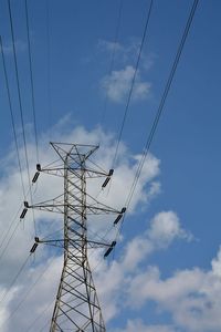 Low angle view of electricity pylon against sky