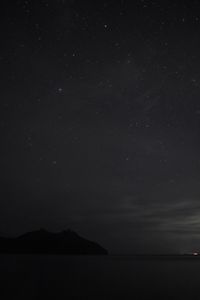 Scenic view of sea against sky at night