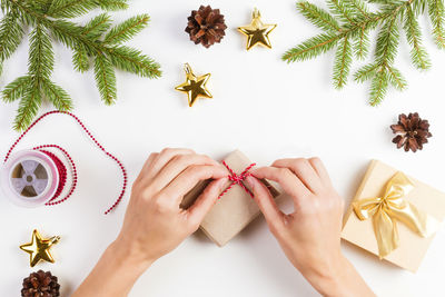 Close-up of woman opening gift box