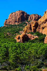 Rock formations on landscape against clear sky