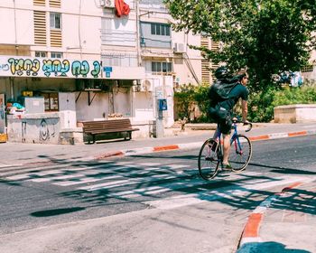 Man riding bicycle on street