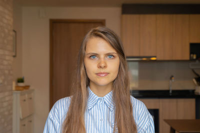 Portrait of beautiful woman at home