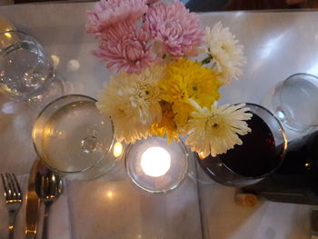 High angle view of illuminated flower vase on table