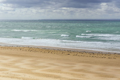 Scenic view of beach against sky