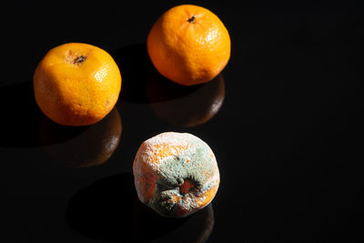 Close-up of oranges against black background