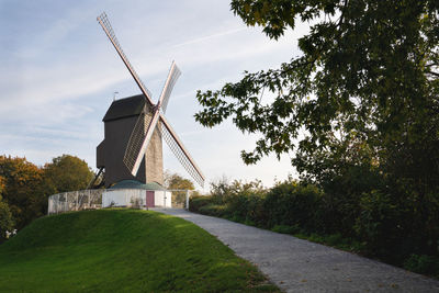 Traditional windmill against sky