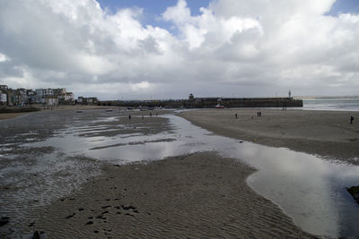 Scenic view of beach against sky