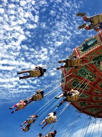 Low angle view of ferris wheel against sky