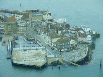 High angle view of harbor by buildings in city