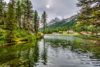 Scenic view of lake by trees against mountains