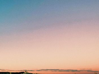 Scenic view of sea against clear sky during sunset