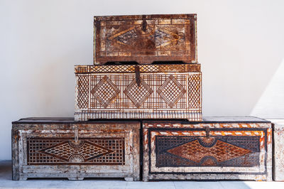 Close-up of wooden box against white background