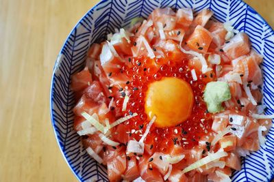 High angle view of chopped fruits in bowl on table