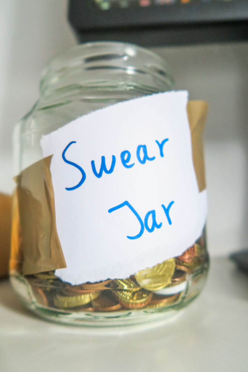 CLOSE-UP OF GLASS OF JAR WITH SPOON