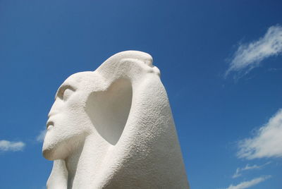 Low angle view of statue against clear blue sky