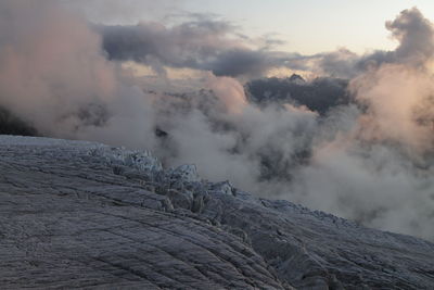 Smoke emitting from volcanic mountain against sky