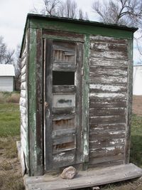 Old wooden structure in front of built structure