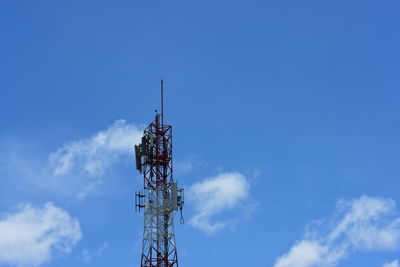 Low angle view of communications tower against sky