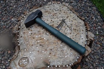 High angle view of hammer and nails