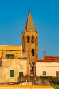 Low angle view of historic building against clear blue sky