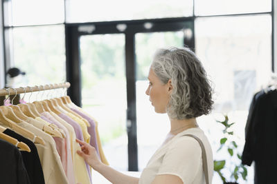 Woman shopping at clothing store