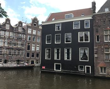 Houses against sky in city