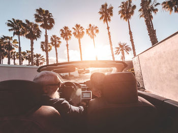 Panoramic view of people sitting in car