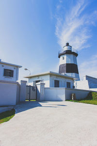 Buildings against blue sky and clouds