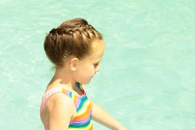 High angle view of girl in swimming pool.